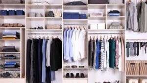 A very organized man's closet with a title that reads What is a Home Inventory
