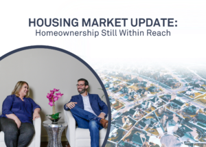 Seated couple smile near aerial view of neighborhood reading Housing Market Update