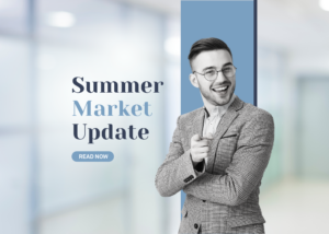 Man does thumbs-up in front of Summer Housing Market Update sign